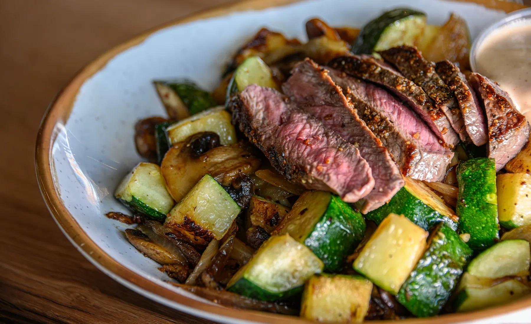 Sliced hibachi steak with grilled zucchini and onions