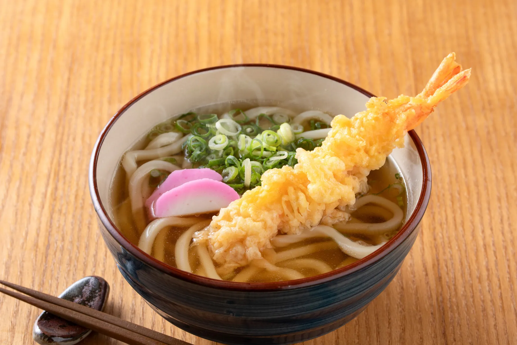 Udon noodle soup topped with shrimp tempura